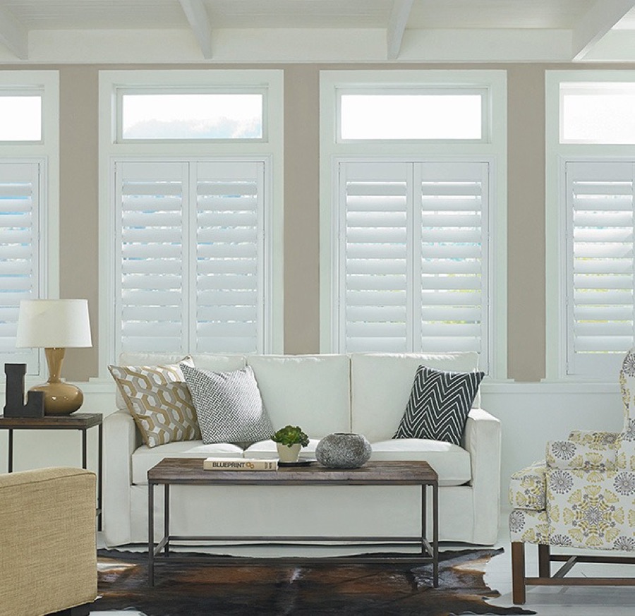 White Wynhaven plantation shutters with louvers tilted open