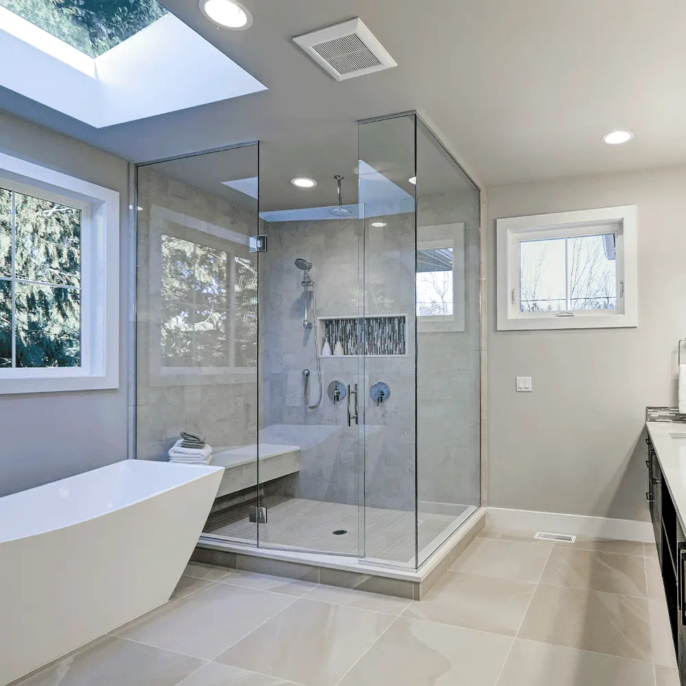 Frameless walk-in glass shower enclosure with clear tempered panels in a Delaware home