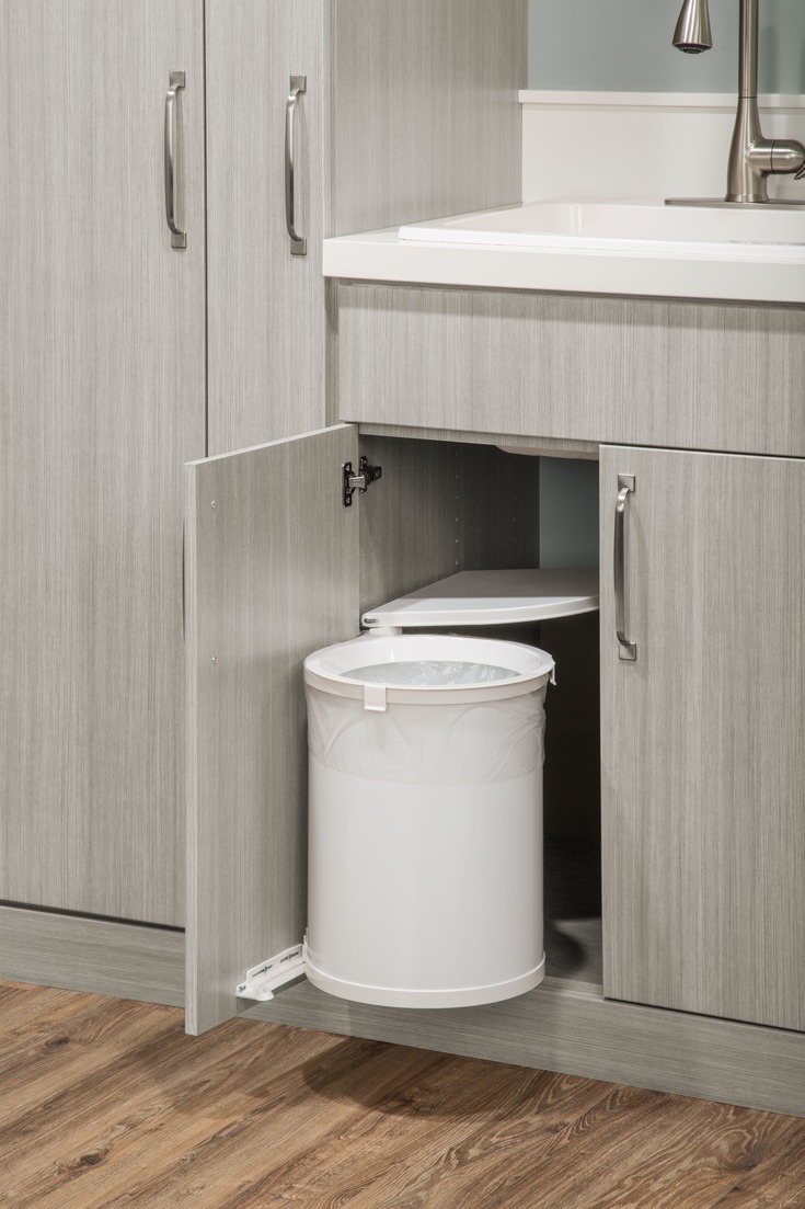 Custom laundry room built-in storage with pull-out cabinet by Atlantic Source, Delaware