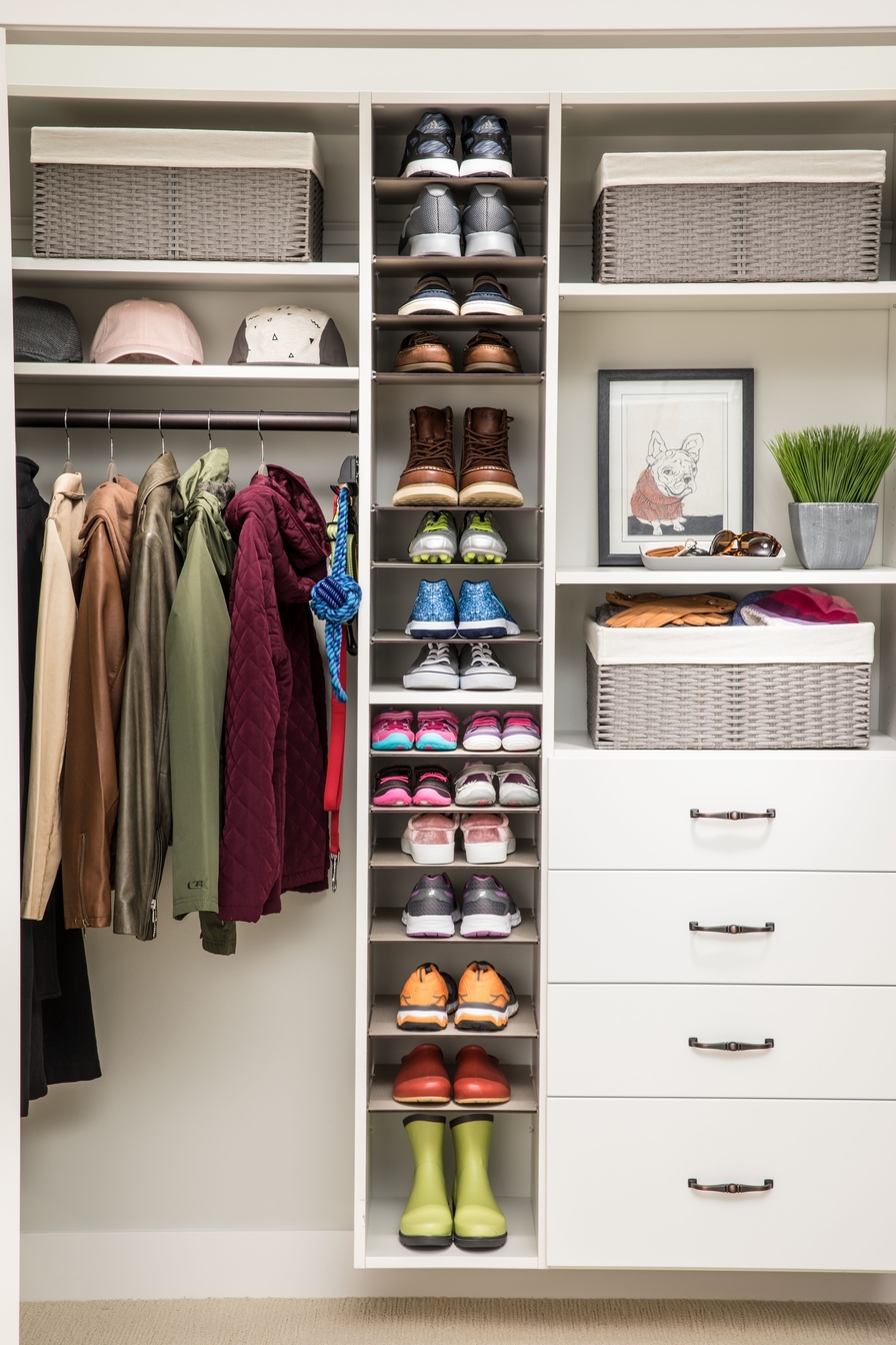 Reach-in closet with a central shoe tower in a Sussex County, Delaware home