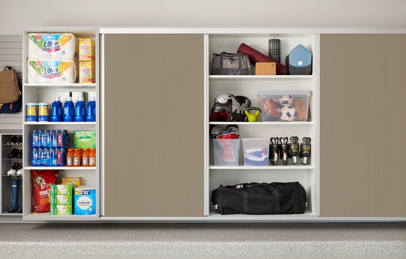 Sliding-door garage wall cabinets storing household and sports gear by Atlantic Source in Delaware